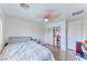 Bright bedroom with wood-look floors, closet, and a ceiling fan for comfort at 4421 Galapagos Ave, North Las Vegas, NV 89084