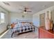 Comfortable bedroom with wood-style floors, a window, ceiling fan and neutral decor at 4421 Galapagos Ave, North Las Vegas, NV 89084