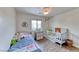 Bright bedroom with wood-look floors, a window, and a closet for storage at 4421 Galapagos Ave, North Las Vegas, NV 89084