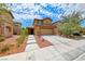 Charming two-story home featuring a well-manicured yard and inviting front entrance at 4421 Galapagos Ave, North Las Vegas, NV 89084