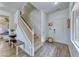 Bright foyer features hardwood floors, white trim, and staircase at 4421 Galapagos Ave, North Las Vegas, NV 89084