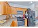 Well-equipped kitchen featuring granite countertops and black appliances at 4421 Galapagos Ave, North Las Vegas, NV 89084