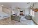 Expansive living area with hardwood floors, large windows, and lots of seating at 4421 Galapagos Ave, North Las Vegas, NV 89084