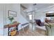 Open-concept living room with beautiful wood floors and staircase at 4421 Galapagos Ave, North Las Vegas, NV 89084