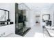 Modern bathroom featuring a glass shower, dual sink vanity, and soaking tub at 50 Grey Feather Dr, Las Vegas, NV 89135
