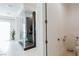 A luxurious bathroom featuring a glass shower, toilet and sink at 50 Grey Feather Dr, Las Vegas, NV 89135