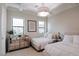 Comfortable bedroom with soft lighting, two twin beds, and a mirrored dresser at 50 Grey Feather Dr, Las Vegas, NV 89135