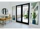 Modern entryway showcasing double doors leading to a landscaped exterior at 50 Grey Feather Dr, Las Vegas, NV 89135