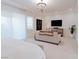 A bright main bedroom featuring a sitting area with a sleek modern design at 50 Grey Feather Dr, Las Vegas, NV 89135