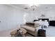 A beautifully designed main bedroom featuring a sitting area and elegant chandelier at 50 Grey Feather Dr, Las Vegas, NV 89135