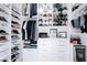 Organized walk-in closet with shelves and drawers for shoes, clothes and accessories at 50 Grey Feather Dr, Las Vegas, NV 89135
