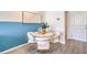Cozy dining area next to a blue accent wall, featuring modern furniture at 5021 Fern Mesa Ave # Lot 114, Las Vegas, NV 89139