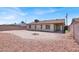 Large backyard with desert landscaping and a view of the single-story house at 5030 E Hacienda Ave, Las Vegas, NV 89122