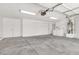 Spacious garage featuring a washer and dryer, ample storage, and bright lighting at 5030 E Hacienda Ave, Las Vegas, NV 89122