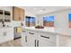 Bright kitchen with stainless steel appliances, an island, and modern cabinetry at 5030 E Hacienda Ave, Las Vegas, NV 89122