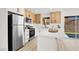 Bright kitchen with stainless steel appliances, an island, and modern cabinetry at 5030 E Hacienda Ave, Las Vegas, NV 89122