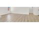 Light and bright living room with wood-look floors, modern finishes, and ample natural light at 5030 E Hacienda Ave, Las Vegas, NV 89122