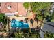 Aerial view showcases the sparkling pool and patio area surrounded by lush landscaping at 5228 Painted Lakes Way, Las Vegas, NV 89149
