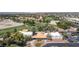 Aerial view displaying a building surrounded by trees, greenery, and a parking lot at 5228 Painted Lakes Way, Las Vegas, NV 89149