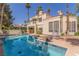 Backyard paradise features a sparkling pool, perfect for enjoying sunny days and outdoor living at 5228 Painted Lakes Way, Las Vegas, NV 89149