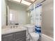 Bathroom featuring a tub and shower combination and single sink vanity at 5228 Painted Lakes Way, Las Vegas, NV 89149