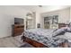 Cozy bedroom featuring a fireplace and a balcony at 5228 Painted Lakes Way, Las Vegas, NV 89149