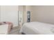 Bedroom showcasing the doorway to an ensuite bathroom and white walls at 5228 Painted Lakes Way, Las Vegas, NV 89149