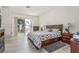 Bright bedroom with a balcony, a fireplace, and a view of the pool at 5228 Painted Lakes Way, Las Vegas, NV 89149