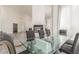 Bright dining room featuring a fireplace and a modern table set at 5228 Painted Lakes Way, Las Vegas, NV 89149