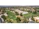 Aerial view of a well-maintained golf course with lush green fairways and mature trees at 5228 Painted Lakes Way, Las Vegas, NV 89149
