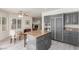 Elegant kitchen with granite countertops, modern appliances, and a cozy dining area at 5228 Painted Lakes Way, Las Vegas, NV 89149