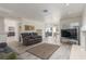 Spacious living room with modern flooring and comfortable seating at 5228 Painted Lakes Way, Las Vegas, NV 89149