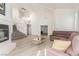 Open-concept living area with high ceilings and a fireplace at 5228 Painted Lakes Way, Las Vegas, NV 89149