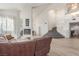 Bright living room featuring a fireplace and staircase at 5228 Painted Lakes Way, Las Vegas, NV 89149