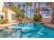 Inviting backyard pool with clear water and palm tree landscaping at 5228 Painted Lakes Way, Las Vegas, NV 89149