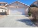 Charming single-story home featuring an attached two-car garage and low-maintenance landscaping at 5404 Walcott Dr, Las Vegas, NV 89118