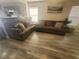 Cozy living area featuring wood-look floors and neutral paint, offering a warm ambiance at 5404 Walcott Dr, Las Vegas, NV 89118