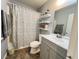 Well-lit bathroom with a shower-tub combo, decorative shower curtain, and neutral color palette at 6292 Yucca Valley Ct, Las Vegas, NV 89142