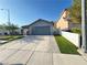 Well-maintained single Gathering home with a wide driveway and desert landscaping at 6292 Yucca Valley Ct, Las Vegas, NV 89142