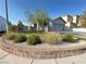Charming single-story home featuring a two-car garage, a well manicured lawn and decorative brickwork at 6292 Yucca Valley Ct, Las Vegas, NV 89142