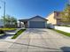Charming single-story home featuring a two-car garage and a well manicured lawn at 6292 Yucca Valley Ct, Las Vegas, NV 89142