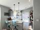 Kitchen featuring a breakfast bar, stainless appliances and ample natural light at 6292 Yucca Valley Ct, Las Vegas, NV 89142