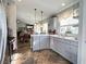 Kitchen with stainless appliances, pendant lights, bar seating and view to dining area at 6292 Yucca Valley Ct, Las Vegas, NV 89142