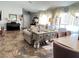 Bright living room with tile flooring, comfortable seating, and neutral color scheme at 6292 Yucca Valley Ct, Las Vegas, NV 89142