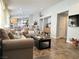Bright living room with tile flooring, comfortable seating, and neutral color scheme at 6292 Yucca Valley Ct, Las Vegas, NV 89142