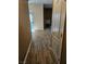 Hallway leading to the living room with updated wood-look flooring at 700 Carnegie St # 4113, Henderson, NV 89052