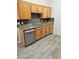Kitchen featuring stainless steel appliances, wood cabinets, and tile flooring at 700 Carnegie St # 4113, Henderson, NV 89052