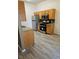 Kitchen with stainless steel appliances, wood cabinets, and tile flooring at 700 Carnegie St # 4113, Henderson, NV 89052