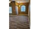 Bright living room featuring wood-look flooring and a window for natural light at 700 Carnegie St # 4113, Henderson, NV 89052