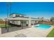 A refreshing pool is the central outdoor feature of this well-kept backyard at 716 Vincent Way, Las Vegas, NV 89145